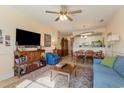 Inviting living room featuring a ceiling fan, tile floors, and an open floor plan at 4503 W Harbour Ct. # S-6, Little River, SC 29566