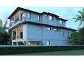 View of back exterior featuring two stories of covered balconies and manicured landscaping for enhanced curb appeal at 4710 Surf St., North Myrtle Beach, SC 29582