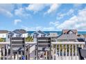 Beautiful ocean views seen from the balcony with gray chairs and oceanfront homes at 512B S Ocean Blvd., Surfside Beach, SC 29575