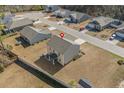 Aerial view of a house highlighting the surrounding neighborhood and large backyard at 55 Porch Ln., Pawleys Island, SC 29585