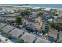 Aerial view showing the condo building, ample parking, and proximity to the beach and ocean at 9661 Shore Dr. # B-22, Myrtle Beach, SC 29572
