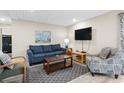 Cozy living room featuring stylish furniture, a modern TV, and nautical artwork at 9661 Shore Dr. # B-22, Myrtle Beach, SC 29572