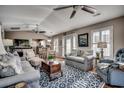 Inviting living room featuring hardwood floors, vaulted ceilings and neutral tones with comfortable furnishings and ceiling fans at 9671 Stillwater Ct., Myrtle Beach, SC 29572