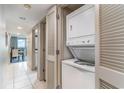 Laundry area with stacked washer and dryer and closet for storage at 107 Ocean Blvd. S # 1707, Myrtle Beach, SC 29577