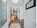 Inviting entryway with wood floors, neutral walls and stylish decor that leads into the home at 109 Astoria Park Loop, Conway, SC 29526