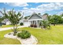 Attractive single-story home with manicured lawn and landscaped flowerbeds adding to curb appeal at 109 Astoria Park Loop, Conway, SC 29526