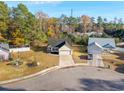Aerial view of a cozy neighborhood showcasing well-maintained lawns and tree-lined streets under a blue sky at 1108 Patricia Ct., Conway, SC 29526
