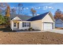 Inviting single-story home featuring a well-kept lawn, neat landscaping, and an attached two-car garage at 1108 Patricia Ct., Conway, SC 29526