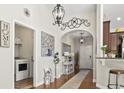 Open entryway with hardwood floors, arched doorway, and decorative accents leading to other rooms at 1412 Rainsbrook Ct., Conway, SC 29526