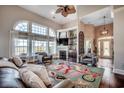 Cozy living room with a fireplace, large windows, and comfortable seating create a welcoming atmosphere at 1624 Portwest Dr., Myrtle Beach, SC 29579