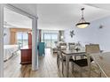 Open-concept condo featuring an ocean view, a living room, a dining room and a bedroom at 2007 S Ocean Blvd. # 2006, Myrtle Beach, SC 29577