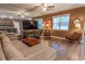 Comfortable living room featuring a large sectional sofa and ample natural light at 244 Legends Village Loop, Myrtle Beach, SC 29579