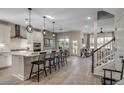 Open-concept kitchen with a large island, pendant lighting, stainless steel appliances, and modern finishes at 2520 Brescia St., Myrtle Beach, SC 29579