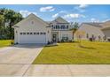 Attractive two-story home with a two-car garage and verdant lawn at 2652 Ellesmere Circle, Myrtle Beach, SC 29579