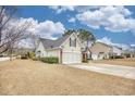This delightful house boasts a well-kept yard and an attached garage on a lovely lot at 3736 Brookhill Dr., Myrtle Beach, SC 29588
