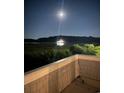Nighttime view of a serene body of water reflecting lights under a bright moon at 4396 Baldwin Ave. # 141, Little River, SC 29566