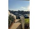 Picturesque water view showcasing boats docked near residential homes under a bright sky at 4396 Baldwin Ave. # 141, Little River, SC 29566
