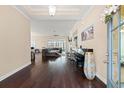 Inviting foyer with dark hardwood floors leading into an open-concept living space at 455 Hyacinth Loop, Murrells Inlet, SC 29576