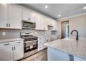 Well-equipped kitchen with stainless steel appliances, granite countertops and white cabinetry at 5430 Shelly Lynn Dr., Myrtle Beach, SC 29579