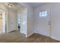 Bright entryway featuring wood floors, a white front door, and access to other rooms at 544 Fox Chase Dr., Conway, SC 29527