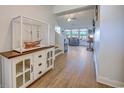 Inviting hallway with wood floors, leading to a living area with a vaulted ceiling and ample natural light at 544 Fox Chase Dr., Conway, SC 29527