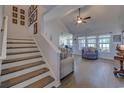 Open-concept living room with wood floors, a vaulted ceiling, and large windows for natural light at 544 Fox Chase Dr., Conway, SC 29527