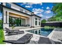Beautiful backyard with a pool, patio, lounge chairs, and a covered patio area at 5515 Porcher Ave., Myrtle Beach, SC 29577