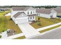 Beautiful home with a spacious yard, complimented by a lush green landscape at 816 Wailea Circle, Little River, SC 29566