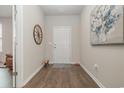 Foyer with hardwood floors, decorative accents, and natural lighting at 816 Wailea Circle, Little River, SC 29566