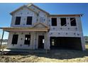 New home construction featuring the exterior frame, windows, and doors awaiting finishes and siding at 903 Agostino Dr., Myrtle Beach, SC 29579