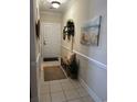 Charming entryway with tile flooring, a decorative bench, and coastal-themed decor creating a welcoming ambiance at 1001 Ray Costin Way # 1605, Murrells Inlet, SC 29576