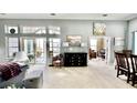 Spacious open-concept living area featuring an adjacent dining area and large windows at 1651 Fairforest Ct., Conway, SC 29526