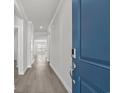 View from front door showcasing the hall with hard surface floors that leads into the home at 2020 Copper Creek Loop, Longs, SC 29568