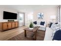 Cozy living room featuring stylish furniture, a patterned rug, and plenty of natural light at 2521 Rowyn St., Longs, SC 29568