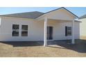 Rear view of home featuring covered patio and vinyl siding at 260 Warner Crossing Way, Loris, SC 29569