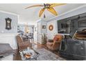 Comfortable living room and dining room featuring stylish furnishings, hardwood floors, and lots of decor at 380 Myrtle Greens Dr. # E, Conway, SC 29526