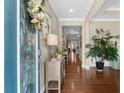 Bright and welcoming foyer features gleaming hardwood floors and stylish decor for a warm entrance at 518 Heartland Ct., Murrells Inlet, SC 29576