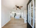 Bright, open-concept kitchen featuring an island, modern appliances, and ample counter space with new floors at 530 Yarboro St., Mullins, SC 29574