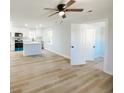 This updated kitchen features an island, stainless steel appliances and flows into an open-concept living area at 530 Yarboro St., Mullins, SC 29574
