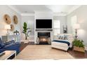Cozy living room with fireplace, large TV, area rug, and decorative accents at 768 Satterwhite Way, Myrtle Beach, SC 29577