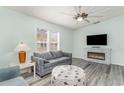 Cozy living room with fireplace, comfortable seating, and ample natural light at 813 Starboard Ct., Murrells Inlet, SC 29576