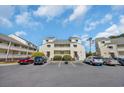 Inviting two-story condo featuring private balconies and convenient parking spaces at 1100 Possum Trot Rd. # C202, North Myrtle Beach, SC 29582