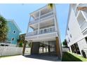 Gorgeous three-story beach house with covered parking and double balconies for stunning views at 113-B 10Th Ave. S, Surfside Beach, SC 29575