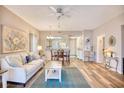 Inviting living room features an open floor plan, hardwood floors, and modern decor at 1221 Tidewater Dr. # 1721, North Myrtle Beach, SC 29582