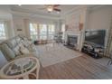 Inviting living room with a fireplace, comfortable seating, and plenty of natural light at 148 Splendor Circle, Murrells Inlet, SC 29576