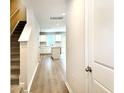Inviting hallway with modern floors leads to a bright and spacious kitchen at 157 B Villa Grande St. # B, Myrtle Beach, SC 29579