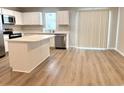 Stylish kitchen with a central island, stainless steel appliances, and white cabinets at 157 B Villa Grande St. # B, Myrtle Beach, SC 29579