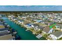 Aerial view of waterfront homes along the canal, showcasing the coastal community at 321 52Nd Ave. N, North Myrtle Beach, SC 29582