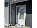 Home entrance with welcome mat, front door, and muted blue and gray accents at 3700 Golf Colony Lane # 18-I, Little River, SC 29566
