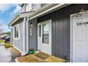 Inviting home entrance featuring a quaint, cozy welcome mat and attractive exterior details at 3700 Golf Colony Lane # 18-I, Little River, SC 29566